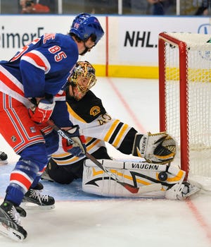 Goalie Tuuka Rask makes a save against the Rangers' Matt Maccarone during the second period of the Bruins' 2-1 victory in an exhibition game on Tuesday night in New York.