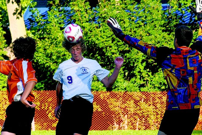 Little Falls Mountie Dylan Krowicki puts his head to the ball between Remsen defender Casey Corrigan (left) and goalkeeper Kody Burke. Krowicki popped the ball over the outstretched arms of Burke and into the net to give Little Falls a 2-1 lead in the second half at Monroe Street Field.