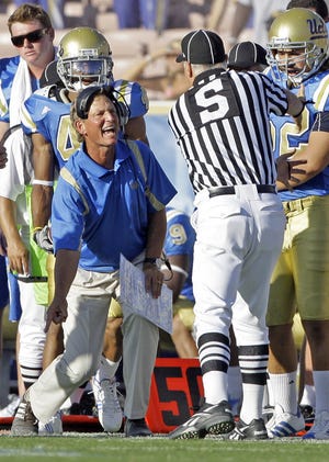 Always excitable UCLA head coach Rick Neuheisel argues that a UCLA pass against San Diego State was caught in bounds, while side judge Mike Weseloh rules it was caught out of bounds during a game at the Rose Bowl in Pasadena, Calif., on Sept. 5.