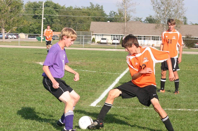 Canton hosted Illini Bluffs on Wednesday in their first-ever varsity soccer match. Josh Florea uses footwork in an attempt to take the ball away from an Illini Bluffs player. The Tigers scored the first three goals on their way to a 3-1 victory.