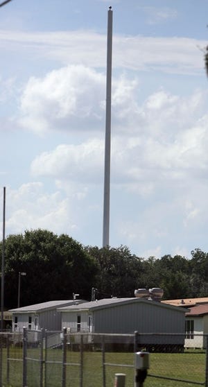 A 190-FOOT CELL PHONE TOWER was built on the grounds of Sikes Elementary School in Lakeland, initially drawing criticism of its appearance and worries from some parents about safety.