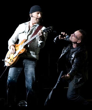 U2's The Edge, left, and Bono perform during the tour's stop in Toronto.