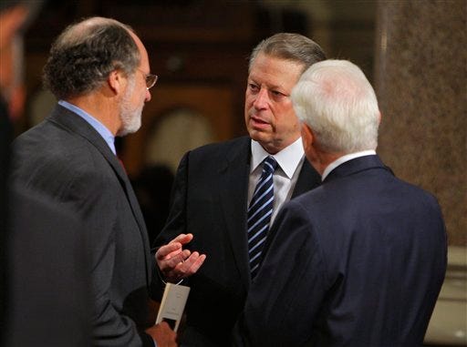 Former Vice President Al Gore, center, talks with New Jersey Gov. Jon Corzine, D-NJ, left, and U.S. Sen. Christopher Dodd, D-Ct., right, during funeral services for U.S. Senator Edward Kennedy at the Basilica of Our Lady of Perpetual Help in Boston, Massachusetts Saturday, August 29, 2009. Senator Kennedy died late Tuesday after a battle with cancer. He was 77.