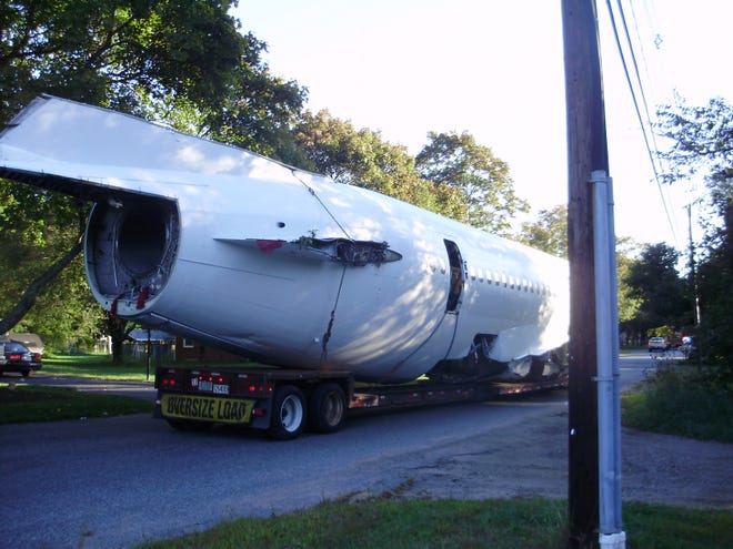The last section of a dismantled Boeing 727 jetliner that will be used in a movie featuring Tom Cruise and Cameron Diaz arrives Saturday in Bridgewater.