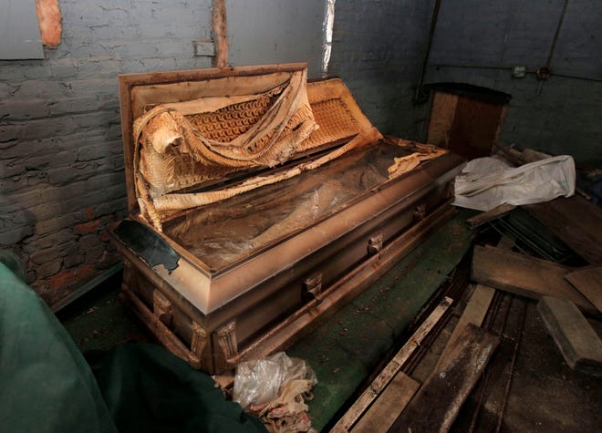 The original glass-topped casket of lynching victim Emmett Till is seen rusting in a shack at the Burr Oak Cemetery in Alsip, Ill.