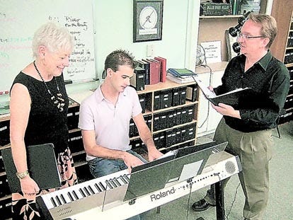Kathleen Vande Berg, director of St. Augustine Singers; Samuel Clein, pianist; and Adam Mayo, tenor, prepare for the St. Augustine Singers concert Mostly Madrigals, which will be at 7:30 p.m. Oct. 4 in the Fellowship Hall of Memorial Presbyterian Church. Contributed photo