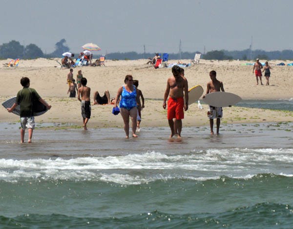 CHATHAM-- 07/29/08 -- Beachgoers wade in surf at the far end of LIghthouse Beach in Chatham.