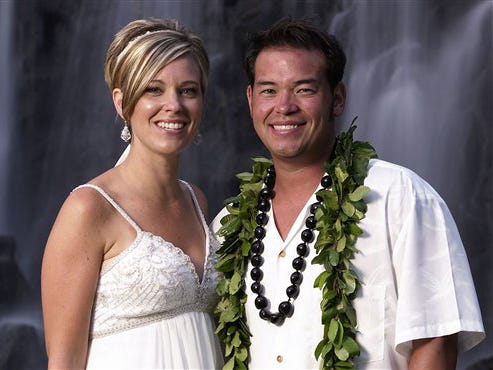 This image released by TLC, shows Jon Gosselin, right, and his wife Kate Gosselin, from the TLC series "Jon & Kate Plus 8," in Hawaii.