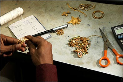 Gold jewelry being appraised at a Manappuram branch in Valapad, India.