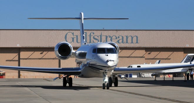 The new Gulfstream G650 rolls out on its own power as it is introduced to an audience of approximately 7,000 sitting in the plane's manufacturing building. (Steve Bisson/Savannah Morning News)