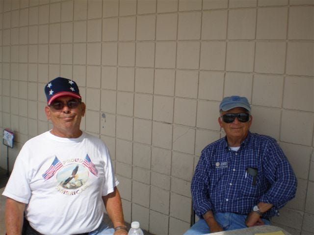 Allen Courteau (left) and Nason Dupuy sell raffle tickets to benefit the Houma Civitan Club on Sept. 19 in front of Kmart in Houma.
