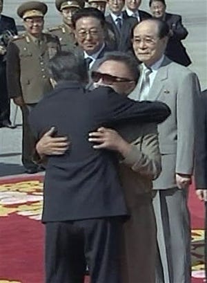 Chinese Premier Wen Jiabao (left) is greeted by North Korean leader Kim Jong Il upon Wen's arrival in Pyongyang, North Korea. Wen arrived Sunday here on a highly anticipated state visit amid signs the North may be willing to restart dialogue over its nuclear programs.