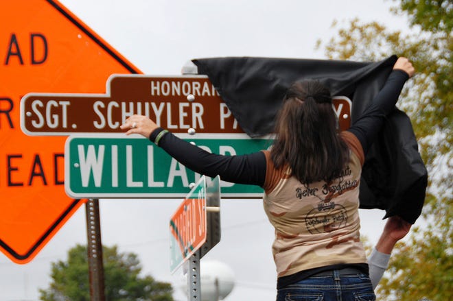 Amber Patch-Troxell of Kewanee, unveils a street sign that was named in honor of her brother, Sgt. Schuyler Patch. Patch was killed in action Feb. 24 by an improvised explosive device in Kandahar, Afghanistan. He was assigned to the Illinois National Guard's Headquarters and Headquarters Troop, 2nd Battalion, 106th Cavalry, based in Kewanee. The unveiling occurred in Kewanee on Saturday.