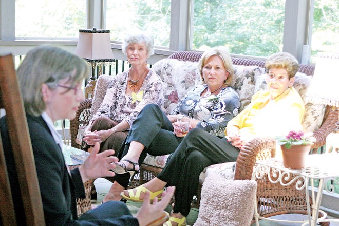 Girls Inc. Executive Director Carol Mullane talks to the Crown Monarchs, who raise money for the nonprofit, Roberta Sommerfeld, from left, Kathie Shearer, and Ruth Ellen Martin.