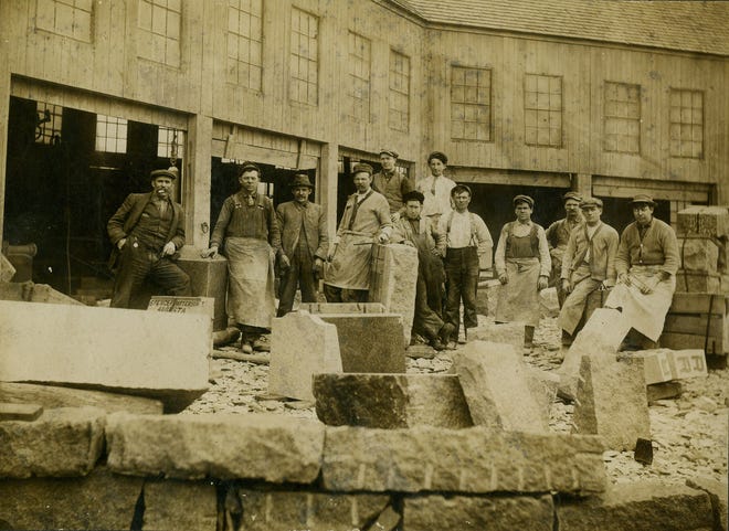 In this undated photo, workers pose at the Clark & Pearce Granite Co. on Gilbert Street in South Quincy. This photo is one of several that have been donated to the proposed Quincy Quarry and Granite Workers Museum.