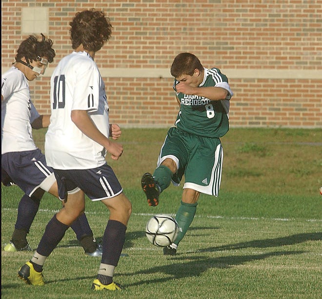 Dighton-Rehoboth's Keith Rose (right) kicks in the winning goal during Monday's affair with Apponequet.