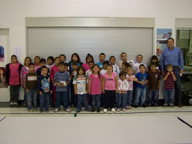 Steve Jacobson, Warwick Elementary Principal, is pictured with the students who had perfect attendance in September.