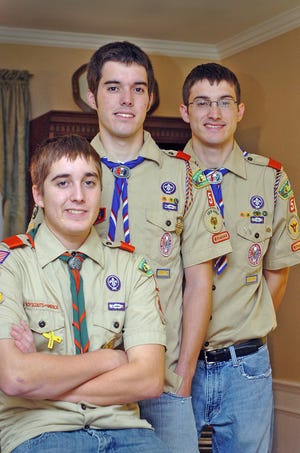 Chris Marotta, left, 15, is making plans for a project to earn his Eagle Scout rank at Boy Scout Troop 5, St. Agatha's, in Milton. His older brothers Tim, center, 17, and Matthew, right, 20, are already Eagle Scouts. Tim earned the rank of Eagle Scout in 2006, and Matthew earned his in 2004.
