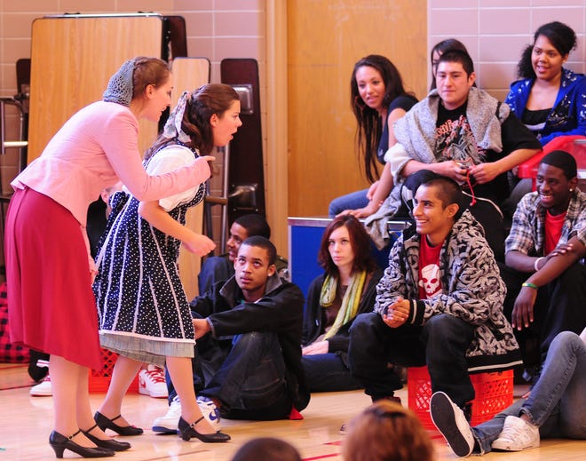 Grand Valley State University theater department’s “Bard to Go” actors, Ann Dillworth, left, and Jill Zwerystein entertain students at Van Raalte Tech Center Friday afternoon. The acting troupe is gearing up for GVSU’s Shakespeare Festival by performing for the students.