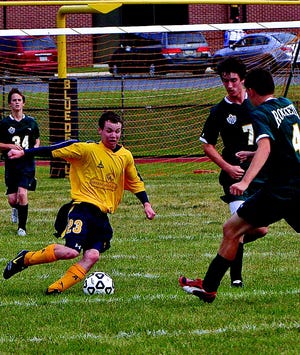 Cody Young moves the ball for the G-A soccer team.