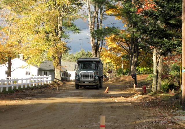 Gail Ober/Citizen Photo

A DUMP TRUCK makes its way along a construction site on Perkins Road in Belmont on Tuesday. Officials are believe the newly connected water pipes along the street as being the possible source of bacterial contamination of the village's water supply.