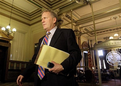 Illinois House Minority Leader Tom Cross, R-Oswego, exits Illinois Gov. Pat Quinn's office at at the Illinois State Capitol in Springfield, Ill., Wednesday Oct. 14, 2009. (AP Photo/Seth Perlman)