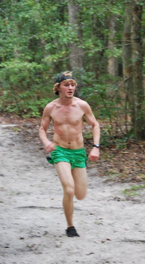 Brad Boyd, 18, won the 15-19 age group in the open 5K race Saturday at New Ebenezer Retreat. (Corey Dickstein/ Effingham Now)