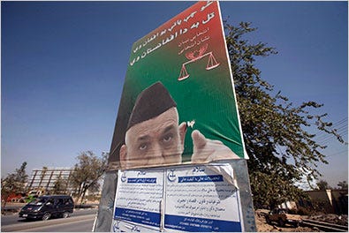 A torn election poster of President Hamid Karzai of Afghanistan in Kabul on Monday.