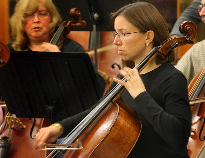 Caroline Hine of Scituate plays cello during a rehearsal of the Brockton Symphony Orchestra at the Brockton Senior Center on Monday night. The symphony kicks off its new season on Sunday with a 3 p.m. concert at the West Junior High School auditorium.