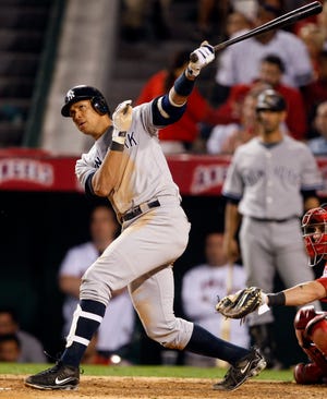 The New York Yankees' Alex Rodriguez hits a home run in the fifth inning of Game 4 of the American League Championship Series against the Los Angeles Angels Tuesday, Oct. 20, 2009, in Anaheim, Calif.
