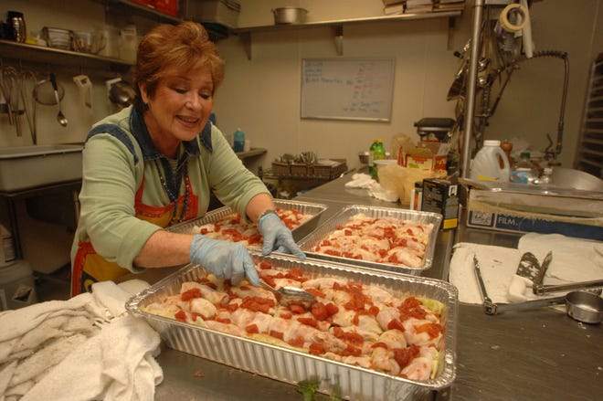 Gail Dinnerstein, chairwoman of the stuffed cabbage committee, prepares the traditional Jewish fare for baking in the kitchen of Mickve Israel Temple for the upcoming Jewish Food Festival. (John Carrington/Savannah Morning News)