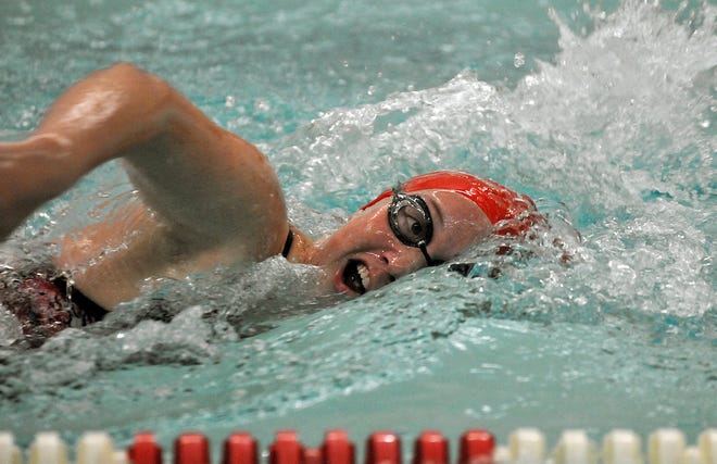 Milford's Megan Kennelly swims in the 200-yard freestyle against Apponequet 10/13/09 in Milford.