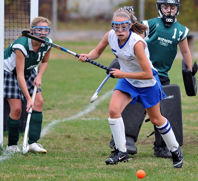Hopedale's Heather Kapatoes (middle) chases down a loose ball near the Nipmuc goal during the Blue Raiders' 4-0 win over the Warriors.