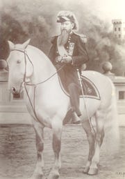 This Knight on his white charger was Dr. W.W. Krape, a 
19th century dentist in Freeport who founded the Knights of the Globe society with its rituals and regalia. The society also encompassed a life-insurance corporation.