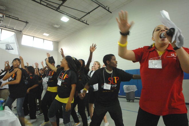 Yvonne Williams "hypes up" the students during the Student Leadership Program kickoff Saturday at Woodville-Tompkins Technical Career Institute. Richard Burkhart/Savannah Morning News