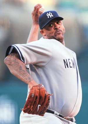 Spahn Award winner CC Sabathia throws during the first inning of Game 4 of the ALCS on Tuesday. AP Photo