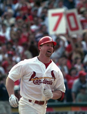 Mark McGwire is going to be a hitting coach for the St. Louis Cardinals. AP photo