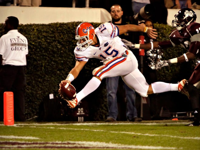 Florida quarterback Tim Tebow reaches out to score a touchdown in the second quarter of their game against Mississippi State on Oct. 24, 2009. Tebow's touchdown tied Herschel Walker's record for SEC rushing touchdowns.