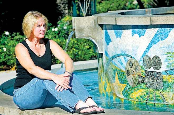 Original: **ADVANCE FOR MONDAY, OCT. 26** This Oct. 16, 2009 photo shows audiologist Elizabeth Alsgaard outside of her home in the Playa Vista area of Los Angeles. Miserable in menopause, Alsgaard pondered an awful choice: drenching hot flashes or hormone therapies that might raise the risk of cancer. What former actress Suzanne Somers raved about held much more appeal ; custom-mixed "bioidentical" hormones, just like ones the body makes. For years, medical groups have warned against custom-compounded hormones. But that has not stopped their popularity, and Somers has promoted them in several best-selling books and on "The Oprah Winfrey Show" earlier this year. (AP Photo/Damian Dovarganes)
Published: No Published Caption