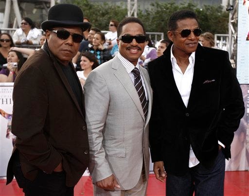 From left, Tito Jackson, Marlon Jackson, and Jackie Jackson arrive to the premiere of "Michael Jackson's This Is It" on Tuesday, Oct. 27, 2009, in Los Angeles.