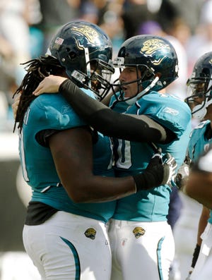 Jaguars kicker Josh Scobee celebrates with teammate Uche Nwaneri after kicking the game-winning field goal in overtime against St. Louis on Oct. 18. The Associated Press