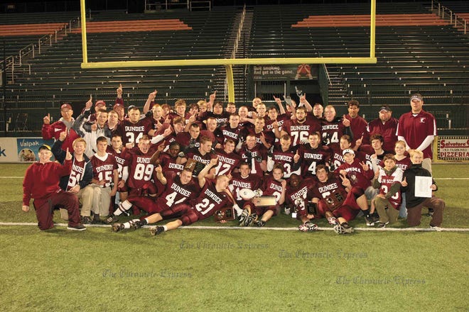 The 2009 Section V Class D Champion Dundee Scots celebrate after their 76-13 victory over Batavia Notre Dame.
