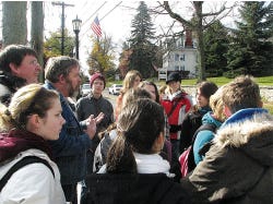 Photo by Seth Augenstein/New Jersey Herald
 Sussex County Historian Wayne McCabe, third from left, talks about the significance of Newton’s old homes and their history as a center of Sussex County to a group of German exchange students.