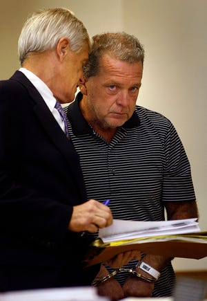 Joseph Beatty, 52, of Quincy, right, with his attorney, Robert Jubinville, at his Aug. 31 arraignment in Quincy District Court.