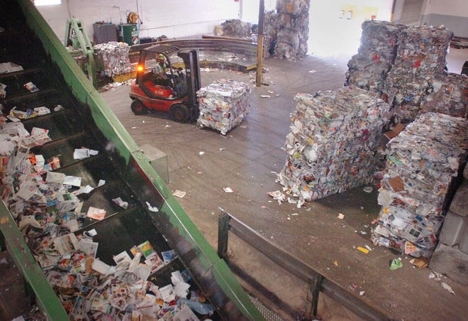 Recycling operations at the Waste Management plant in Avon. Recyclables after being compressed into blocks.