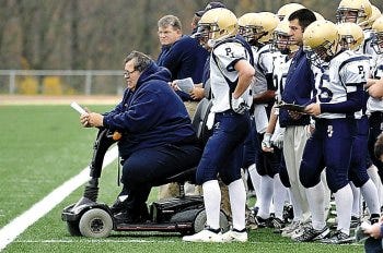 Photo by Patti Gallagher/For the New Jersey Herald Pope John coach Vic Paternostro watches his team in action against Mendham in the first half of his record-breaking victory Saturday. Paternostro was taken to the hospital at halftime with flu-like symptoms.