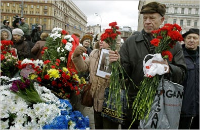 Russians laid flowers at a monument in Moscow on Friday in a tribute to victims of political repression by the Soviet Union. The monument is a slab of stone from a Soviet labor camp.