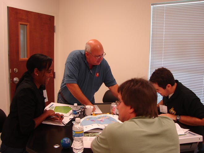 St. James Parish Environmental Science Teachers work with Malhon Doucet from Project Learning Tree Trainer on Project at RPCC’s 1st Environmental Science Workshop for Teachers. (left to right): Valerie Steward, Malhon Doucet, James Oubre, and Kermit Gauthreaux