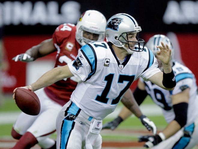 Panthers quarterback Jake Delhomme scrambles against the Cardinals on Sunday in Glendale, Ariz. Delhomme only passed for 90 yards but didn’t commit any turnovers.