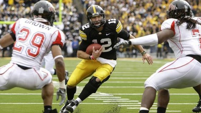 Undefeated Iowa and quarterback Ricky Stanzi (12) have defeated Penn State and are No. 6 in the BCS rankings, but close wins over Northern Iowa and Arkansas State, above, hurt the Hawkeyes.